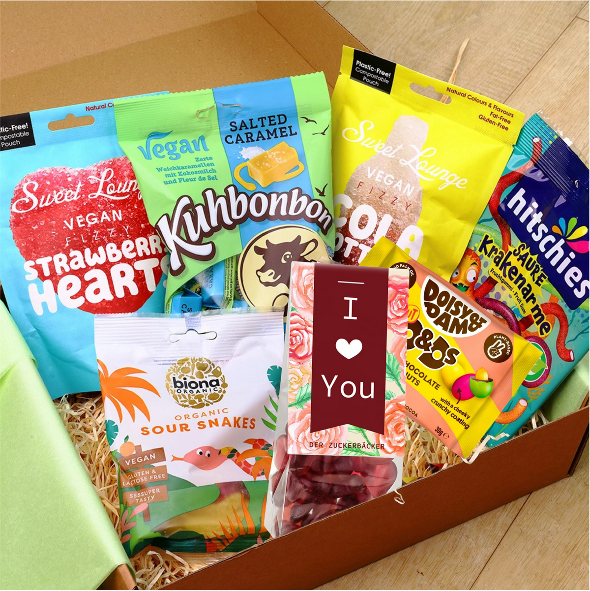 Coffret cadeau vegan ouvert avec 7 paquets de bonbons
